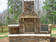 outdoor fireplace,with  woodboxes